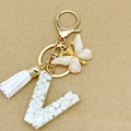 Letter V keychain with gold butterfly and white resin stone texture and tassel charm - Letter V