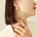 French vintage style 18K gold plated star stud earrings and woven ring on model - Gold
