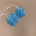 Light blue irregular resin earrings with silver needles and vertical brushed texture - Blue Apple Oval