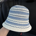 Close-up of the breathable openwork crochet knit and striped pattern on the bucket hat - Blue