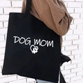 Black canvas tote bag with white Dog Mom print and heart paw graphic for women - DOG MOM Handwritten Print