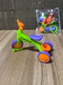 Miniature sport tricycle toy in green, orange and purple with SPORT lettering - Assembly Tricycle / Green