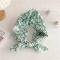 Green silk scarf with white floral pattern tied in a bow on a minimalist white desk - Water Green Floral