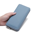 Dusty blue long leather zip wallet with lychee pattern held by hand for display - 20x2.5x10cm / Sky Blue