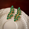 Vintage golden branch earrings with green leaf gemstones on white ceramic plate - Silver Pin Gold Rhinestone Vintage Branch Gemstone Tassel