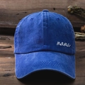 Close-up of white mama embroidery on washed denim baseball cap with vintage texture - One Size / Washed Royal Blue
