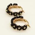 Detail of bohemian hoop earrings featuring black bead flower patterns on gold wire - Black Floral Style (GZ-E220031A)
