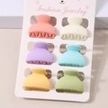 Set of six colorful matte mini hair claws in vibrant macaron colors on display card - Semicircle Style / 6-Piece Set