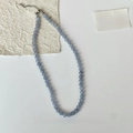 Detail of light blue beaded necklace with silver extension chain and lobster clasp - 8mm / Blue
