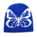 Detailed view of blue plush beanie with white butterfly jacquard pattern - M(54-60cm) / Sapphire Blue
