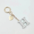 Golden keychain with rhinestone-encrusted letter H and heart charm accessory - Letter H