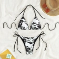 Detailed flat lay of a marble print lace-up bikini with summer beach accessories - XS / Black & White Tie-Dye