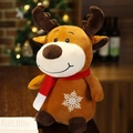 Close-up of soft brown reindeer plush toy with red scarf and snowflake embroidery details - Elk