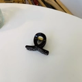 Top view of a glossy black minimalist twist hair claw clip with a gold metal spring - Mini Butterfly Clip X-Shaped (Approx. 4cm) / Chocolate
