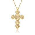 Detailed close-up of a gold cross pendant necklace featuring inlaid heart-shaped cubic zirconia - White