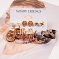 Detail view of 12-piece gold earring set with pearls and leopard acrylic on display card - Leopard Geometric Style 1 (12 Pieces Set)