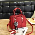 Dark red lychee pattern faux leather tote with plush charm and woven V-stitch design - Burgundy