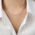 Minimalist silver geometric bamboo necklace shown on model with ribbed texture detail - Cube Style / Steel