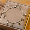 Minimalist silver chain bracelet featuring polished round bell charms on a jewelry box - Stainless Steel Silver Bell Anklet (10914)