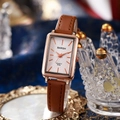 Detail of rose gold square watch with brown leather strap displayed on a crystal crown - Brown Strap White Dial Style (PS2512-044-01)