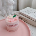 Pink flower shaped scented candle in a glass jar with watercolor Thank You label - Sakura - Goji & Tarocco Blood Orange Scent