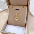 Close-up of a gold crown heart necklace with sparkling crystals in a beige jewelry box - Titanium Steel Chain / Copper Micro-inlaid Pendant / Crown Heart Pendant (J527)