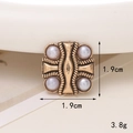 Macro shot of 1.9cm vintage pearl shoe charm featuring golden finish and 3.8g weight - D1728 4 Pearls Accessory
