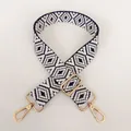 Detail showing dark blue geometric rhombus pattern weave and gold metal hardware - Dark Blue + Gold Hardware