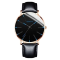Reloj Geneva minimalista dorado con esfera negra e índices azules en acero inoxidable - Caja Oro Rosa Esfera Negra Aguja Azul Correa Cuero Negra