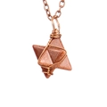 Detailed view of hand-woven wire wrapped hexagonal star pendant with natural stone - Antique Copper + Goldstone