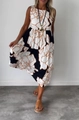 Sleeveless maxi dress with bold black, white, and brown floral prints and waist tie - S / Bottoms / White