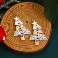 Christmas tree tiered metal earrings with gold stars on a natural wood background - Patchwork Gold and Silver Tree (10261)