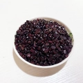 Polished dark red garnet crystal chips in a white ceramic bowl for DIY crafts and decor - Garnet