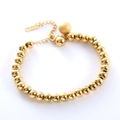 Pulsera de cuentas doradas con colgante mate, perlas pulidas y cierre de mosquetón - Dorado