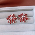 Detailed close-up of red firework stud earrings with zircon accents and silver finish - Silver & Red (Silver Needle)