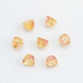 Macro shot of 8mm faceted champagne glass beads for DIY jewelry and Christmas pendants - Gold Rose Red