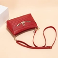 Deep red quilted crossbody bag with golden swan clasp and adjustable strap for women - Red