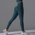 Detail of high-waist seamless yoga leggings with scrunch butt lift and sculpting texture - Black Frame Blue Lens Retro
