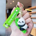 Detail of cute 3D panda keychain with green silicone strap and golden metal clasp - Gen 1 Climbing Bamboo