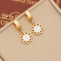 Detailed close-up of golden sun-flower earring with sparkling white rhinestones - Flower Style / Gold