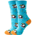Blue crew socks featuring surfing cartoon penguins with orange accents and waves - Surfing Bird