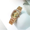 Montre quartz luxe femme dorée avec lunette diamant ovale et bracelet strass brillant - Tout Or