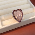 Detailed view of a silver heart-shaped ring with a large pink zircon in a velvet box - Silver-Purple