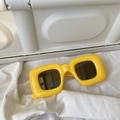 Retro thick yellow square sunglasses with dark brown lenses on white backdrop - Inflatable Square Yellow