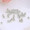 Détail macro de perles rondes argentées polies pour la création de bijoux DIY - 3mm (Trou de 1.2mm) / Or Blanc