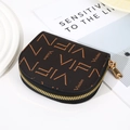 Brown half-moon coin purse with letter print and golden zipper detail on white table - Coffee (VIFN Letter)