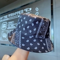 Reversible black bucket hat with white paisley print in a trendy street style look - One Size / Black