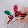 Handmade crochet bunny ear hair clip in white and red with a bow and pearl detail - Red Green White Christmas Rabbit Ears