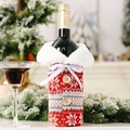 Detail of red knit wine bottle cover with snowflake pattern and white faux fur collar - Type A (Red Snowflake)