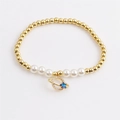 Elegant gold bead and pearl bracelet featuring a crystal ring and blue star charm - Golden Planet Pearl Style